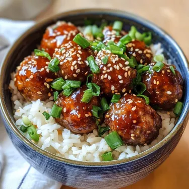 A bowl of food with rice and meatballs.
