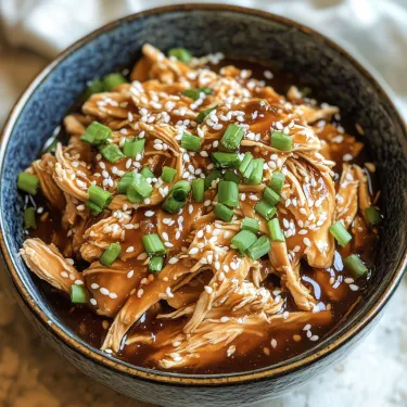 A bowl of chicken with green onions.