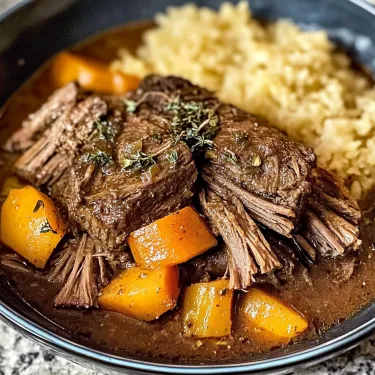 A bowl of beef and rice.