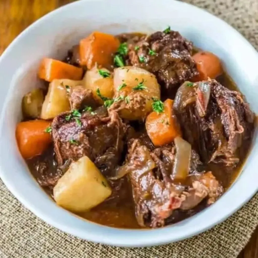 A bowl of meat and vegetables.